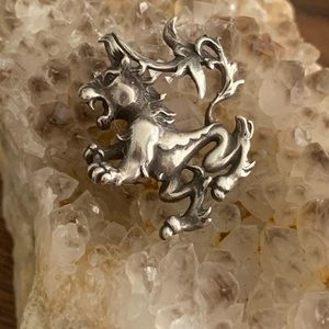 Lion pendant in sterling silver.